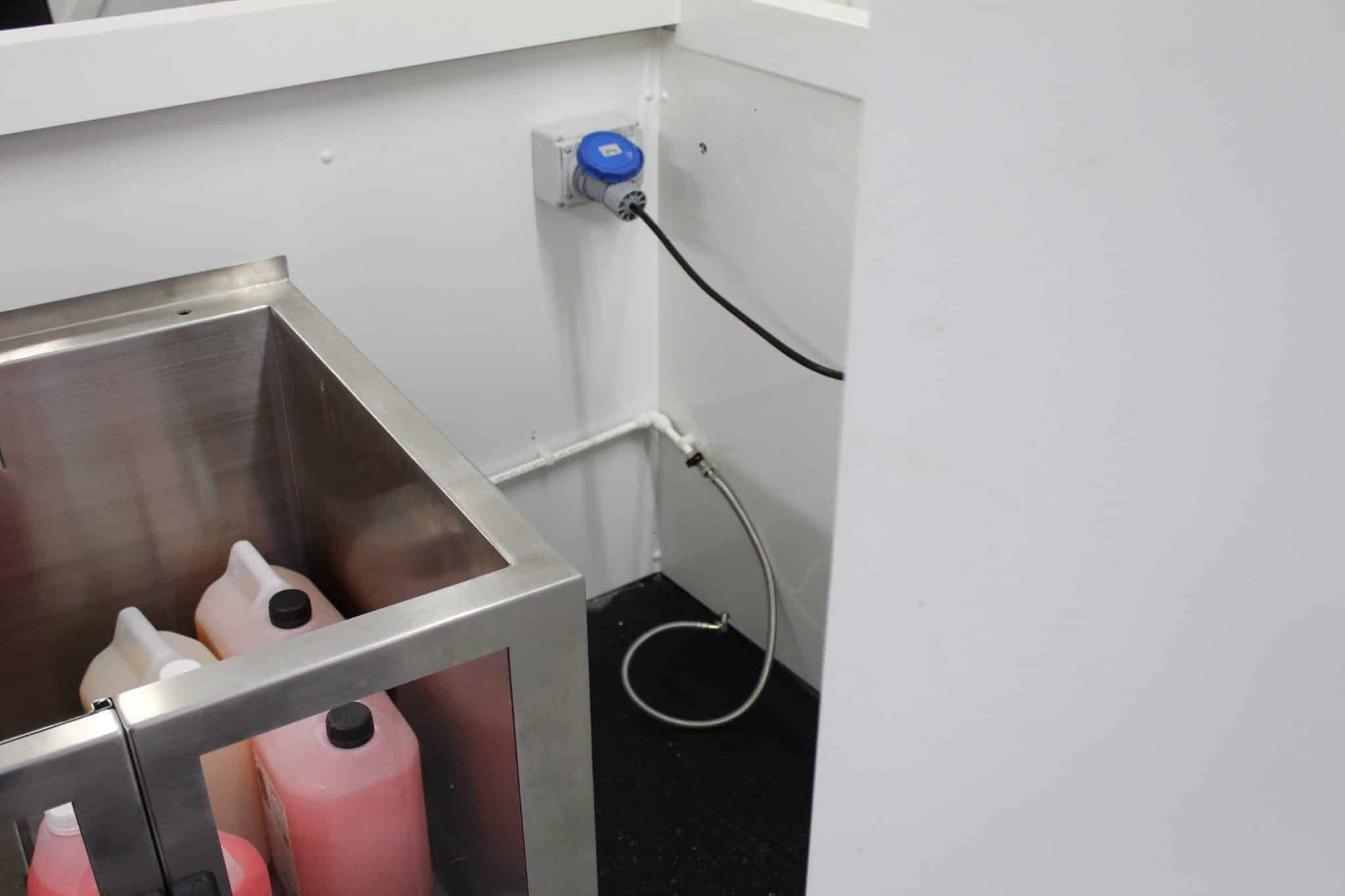 Self-service dog wash machine installed at a dog-friendly business